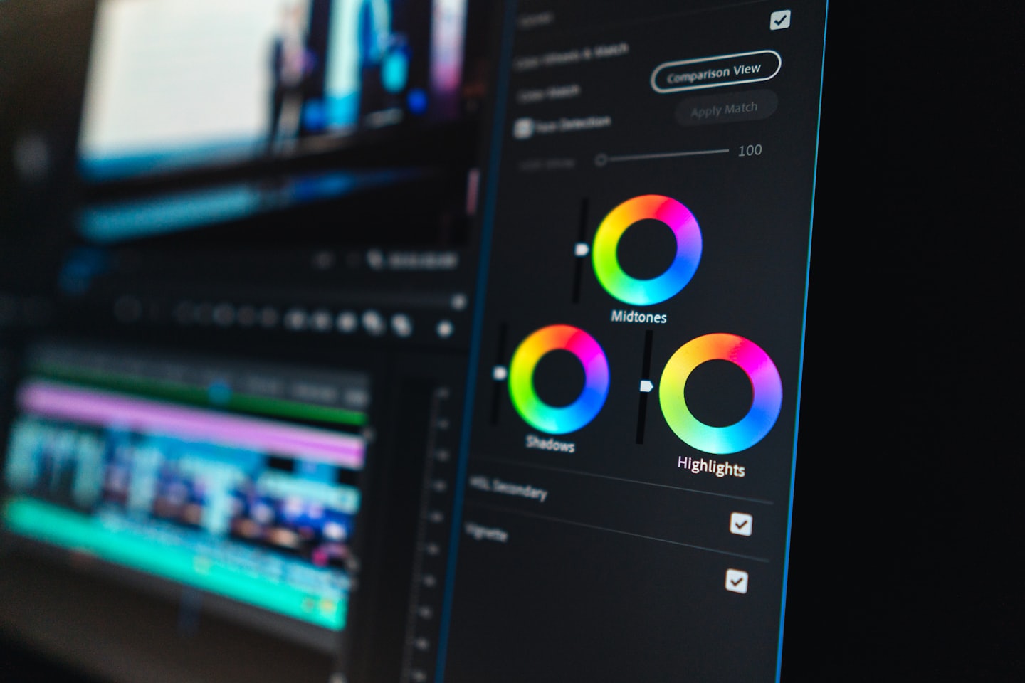 Computer monitor displaying color grading tools in video editing software.